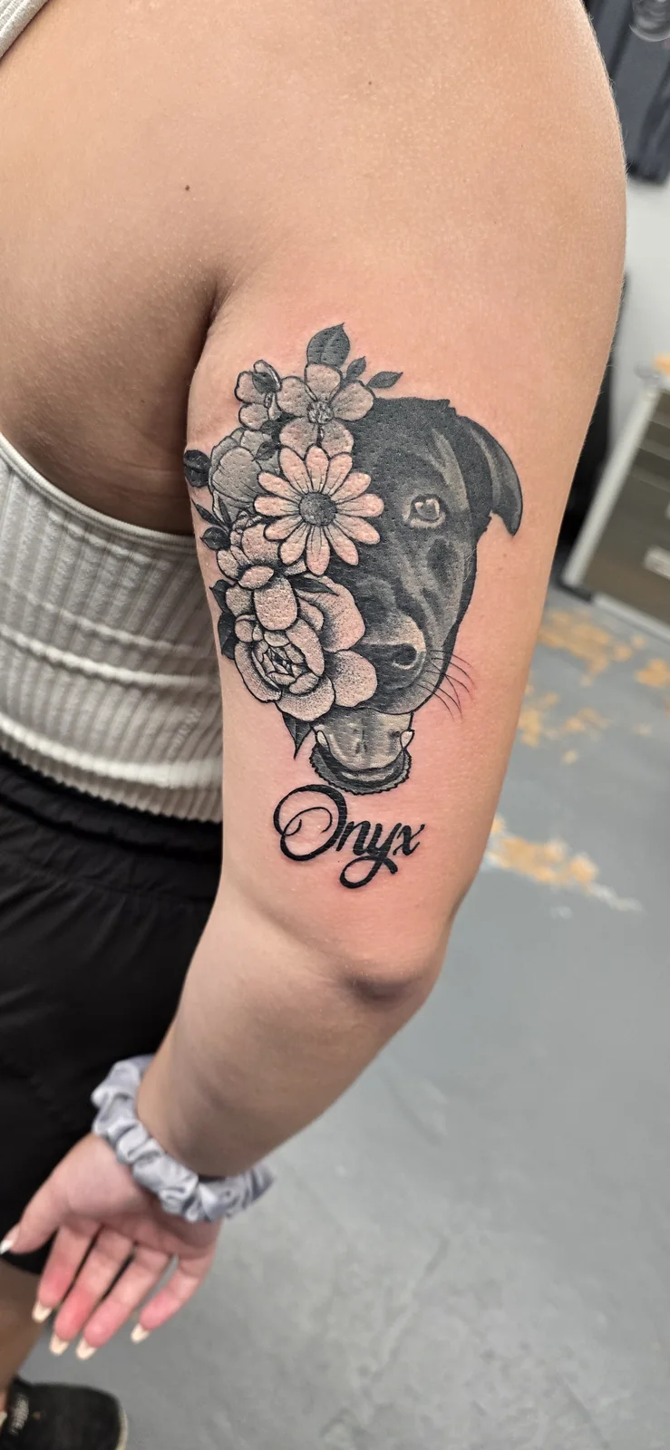 Black and gray floral tattoo by Branded Key Tattoo